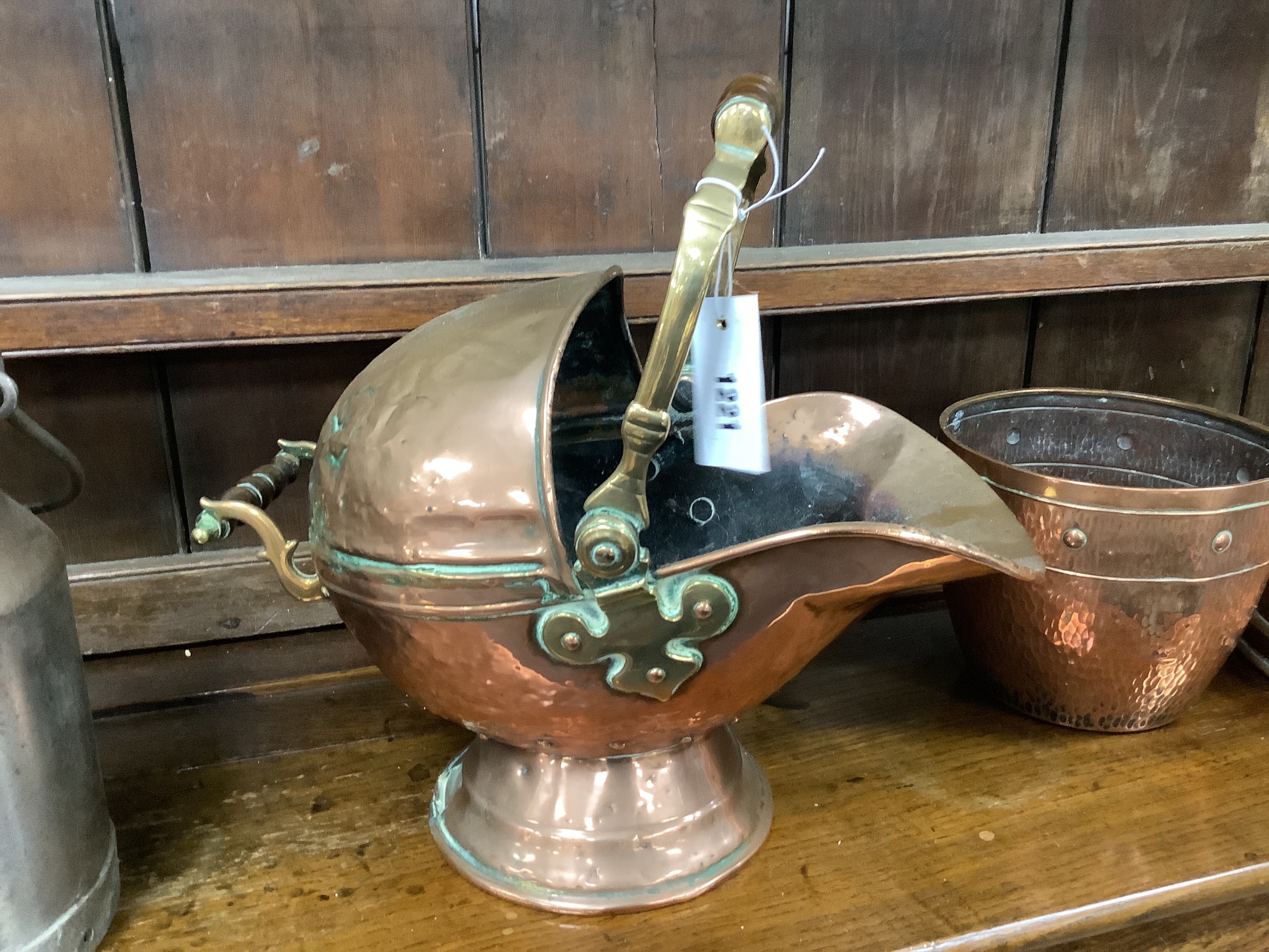 A Victorian copper coal scuttle, milk pail and two others